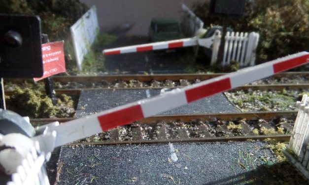 Installing an automated level crossing with lights, sound and moving bars or gates